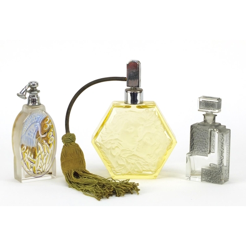 3155 - Two Art Deco glass atomisers and a scent bottle, including one enamelled with a crane, the largest 1... 