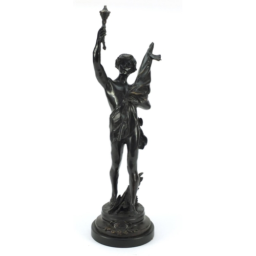 4005 - Large patinated bronze study of a young semi-nude male holding a bag and torch, 63.5cm high