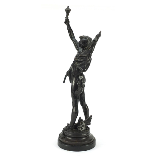 4005 - Large patinated bronze study of a young semi-nude male holding a bag and torch, 63.5cm high