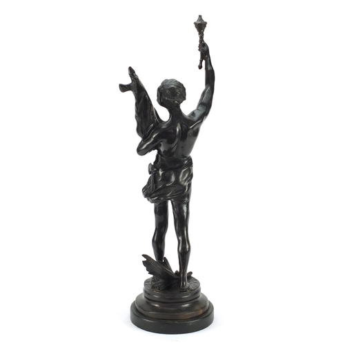 4005 - Large patinated bronze study of a young semi-nude male holding a bag and torch, 63.5cm high