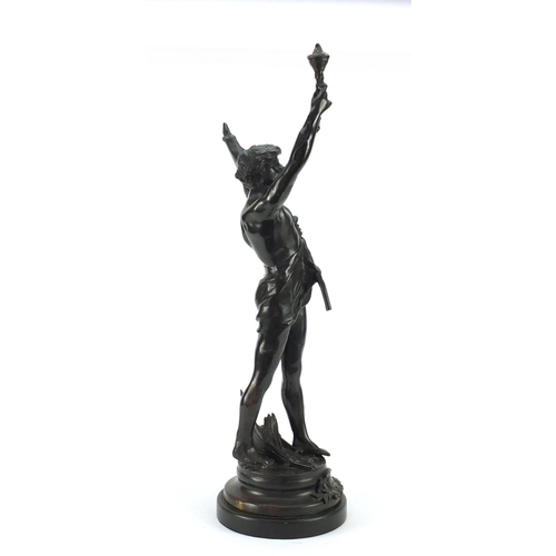 4005 - Large patinated bronze study of a young semi-nude male holding a bag and torch, 63.5cm high