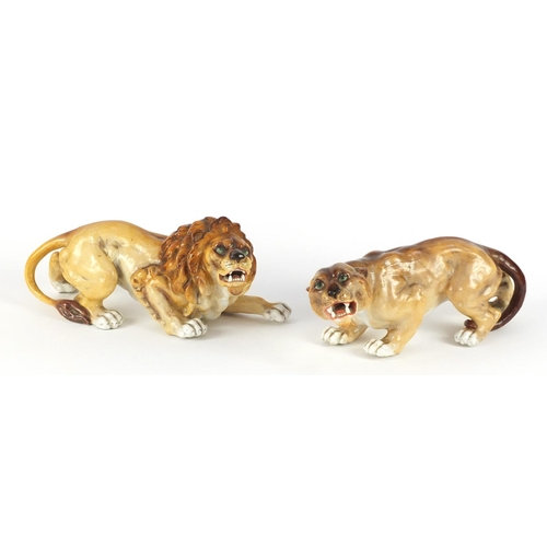 3911 - Two German hand painted porcelain animals by Sitzendorf comprising a lion and lioness, the largest 2... 