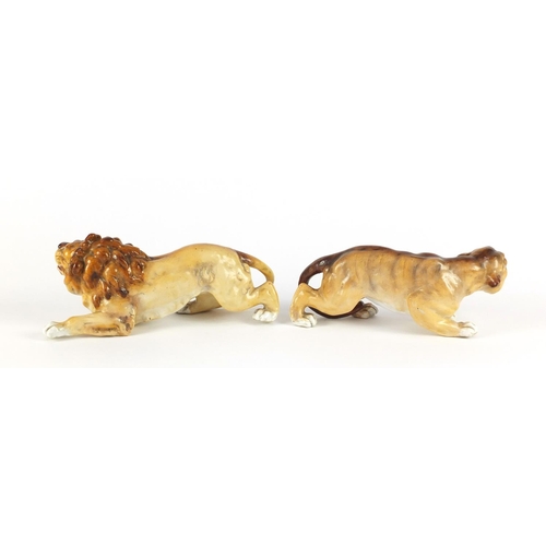 3911 - Two German hand painted porcelain animals by Sitzendorf comprising a lion and lioness, the largest 2... 