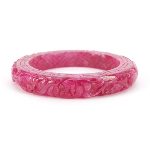 5259 - Chinese pink jade bangle carved with water dragons, 8.5cm in diameter