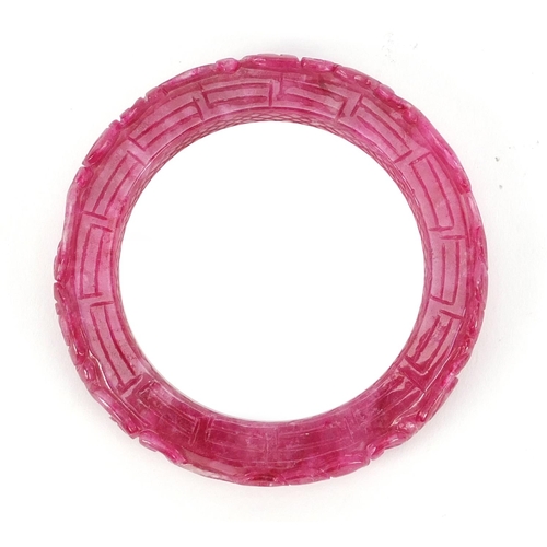 5259 - Chinese pink jade bangle carved with water dragons, 8.5cm in diameter