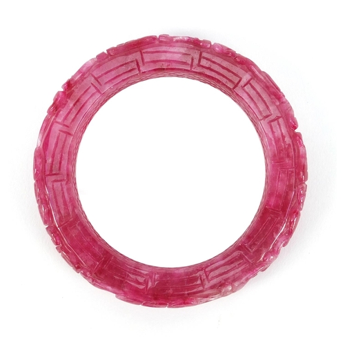 5259 - Chinese pink jade bangle carved with water dragons, 8.5cm in diameter