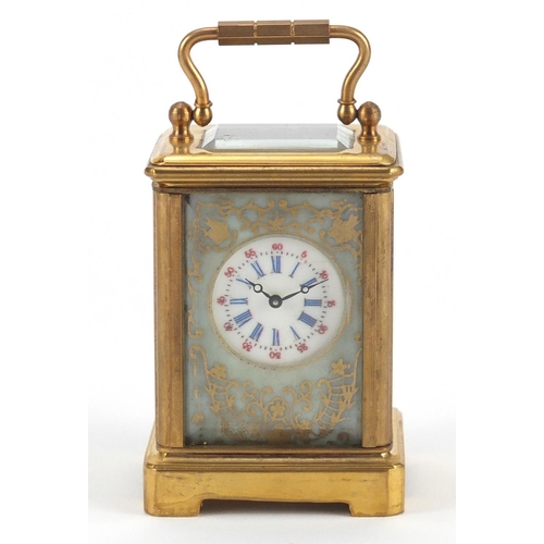 3056 - Miniature brass cased carriage clock with porcelain panels, hand painted and gilded with flowers, 6c... 