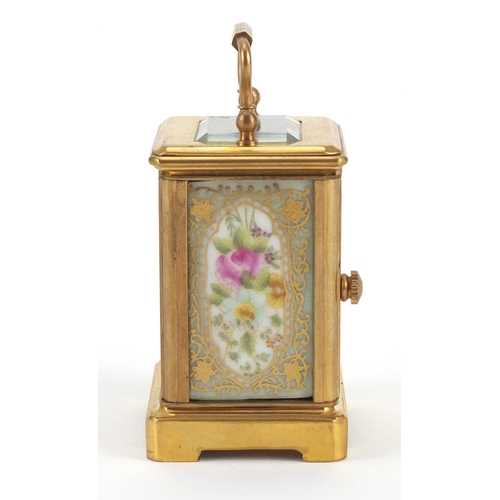 3056 - Miniature brass cased carriage clock with porcelain panels, hand painted and gilded with flowers, 6c... 