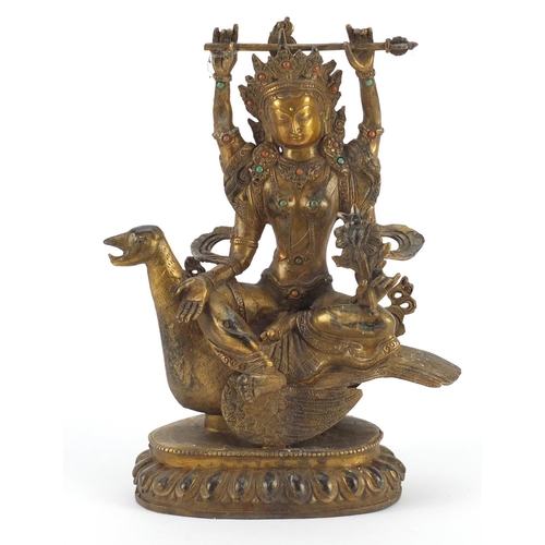 3944 - Chino-Tibetan gilt bronze deity set with coloured cabochons, 26cm high