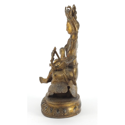 3944 - Chino-Tibetan gilt bronze deity set with coloured cabochons, 26cm high