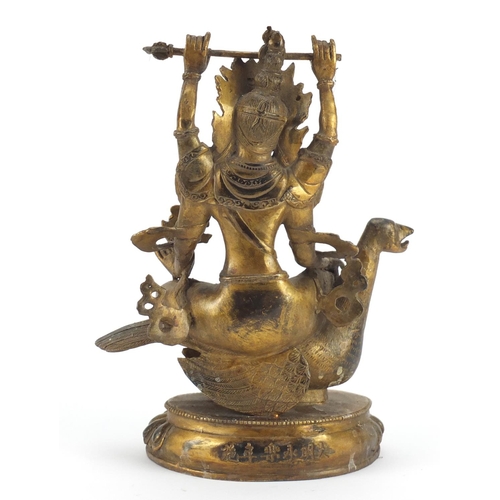 3944 - Chino-Tibetan gilt bronze deity set with coloured cabochons, 26cm high