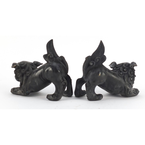 3943 - Pair of Chinese patinated bronze Foo dogs, each 16cm in length