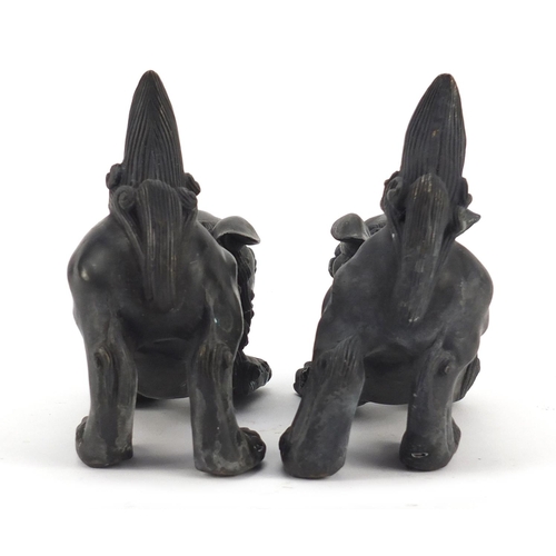 3943 - Pair of Chinese patinated bronze Foo dogs, each 16cm in length