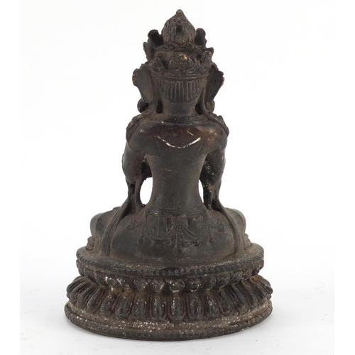 3567 - Chino-Tibetan patinated bronze figure of seated Buddha, 19cm high