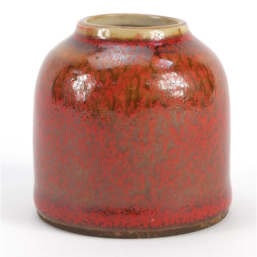 3381 - Chinese porcelain brush washer having a mottled red glaze, blue ring marks to the base, 6.5cm high