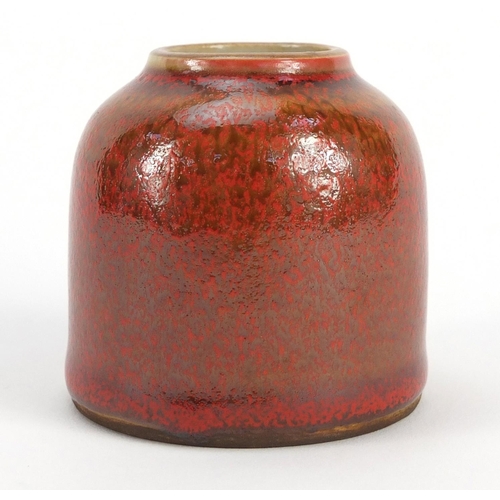 3381 - Chinese porcelain brush washer having a mottled red glaze, blue ring marks to the base, 6.5cm high