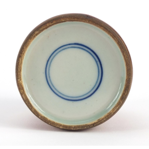 3381 - Chinese porcelain brush washer having a mottled red glaze, blue ring marks to the base, 6.5cm high