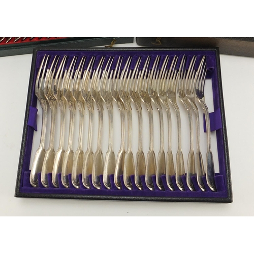 3934 - Set of eighteen German silver knives, forks and spoons, all housed in a velvet and silk lined tooled... 