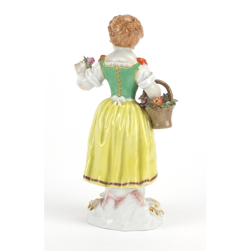 3280 - 19th century Meissen porcelain figurine of a girl holding a basket of flowers, blue cross sword mark... 