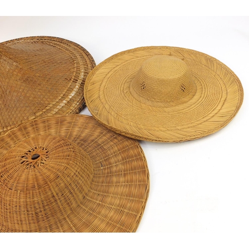 4110 - Vintage hats including two large Asian sampan and a straw boater, the largest 60cm in diameter