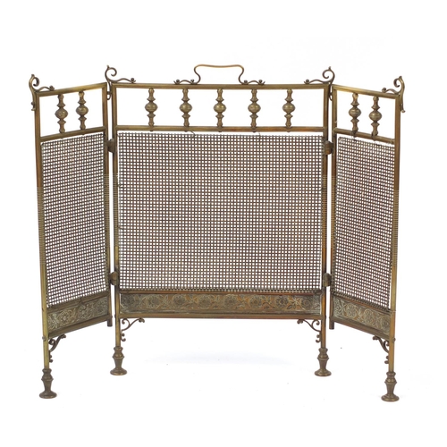 3594 - Arts & Crafts folding brass fire screen with floral border, 66cm high