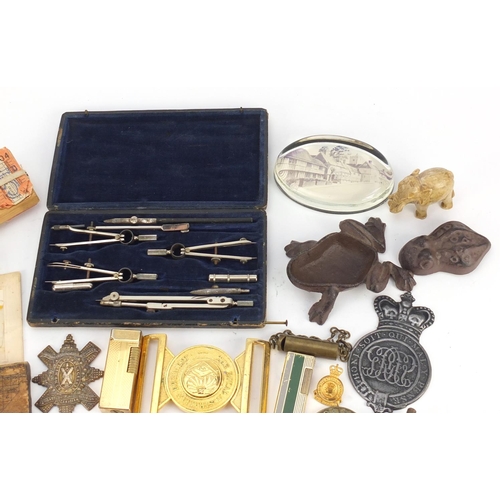 5232 - Sundry items including military cap badges, pocket lighters and bus tickets