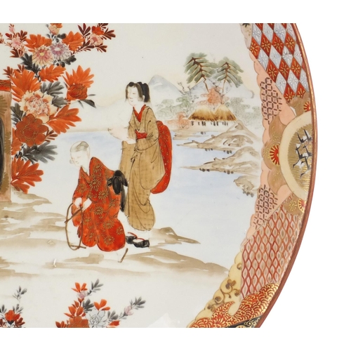 3793 - Japanese Kutani porcelain charger, hand painted with mothers and children before water within a bord... 