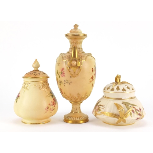 3362 - Two Royal Worcester blush ivory potpourri vases with covers and a vase with cover and twin handles, ... 