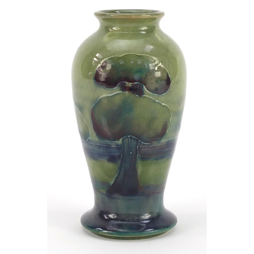 3159 - William Moorcroft pottery baluster vase hand painted in the Hazeldene pattern, 10cm high