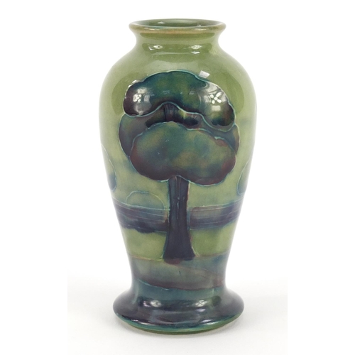 3159 - William Moorcroft pottery baluster vase hand painted in the Hazeldene pattern, 10cm high