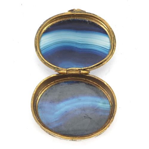 3183 - Oval enamelled brass and blue agate patch box with hinged lid, 5cm wide