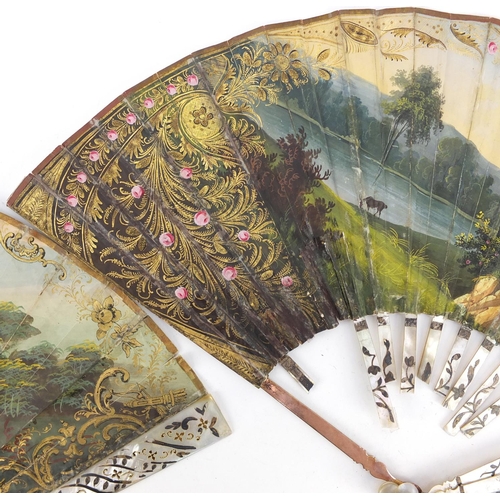 3982 - Two 19th century fans with mother of pearl sticks having silver inlay, each hand painted with classi... 