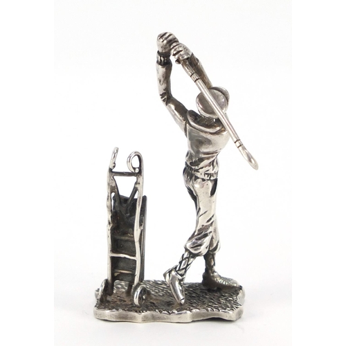 3338 - Silver figure of a golfer with caddy, indistinct impressed marks to the base, 6.5cm high, 31.8g