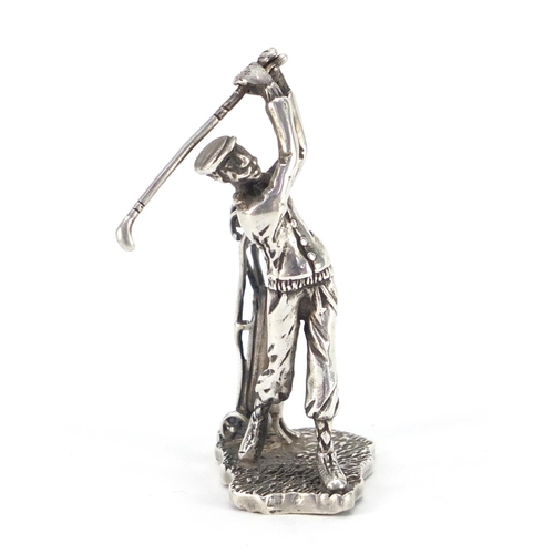 3338 - Silver figure of a golfer with caddy, indistinct impressed marks to the base, 6.5cm high, 31.8g