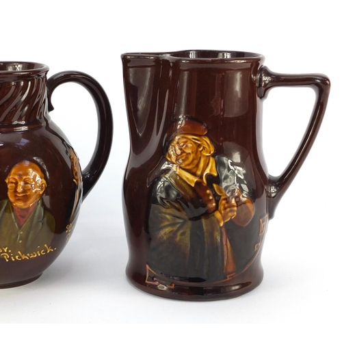 3483 - Three Royal Doulton Kingsware jugs, including an example decorated with Charles Dickens characters, ... 