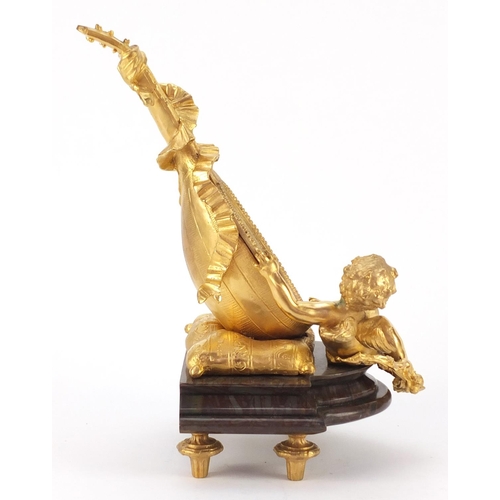 4003 - French Empire style gilt bronze table mirror in the form of putti with a mandolin, raised on a shape... 