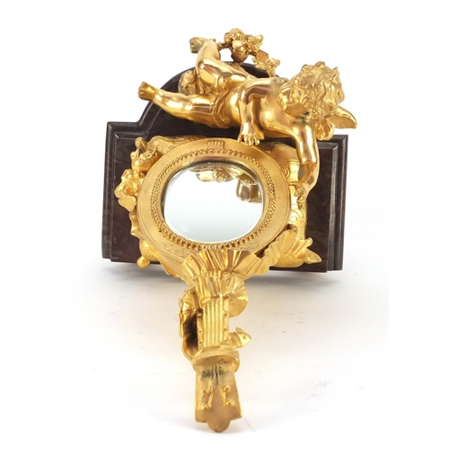 4003 - French Empire style gilt bronze table mirror in the form of putti with a mandolin, raised on a shape... 