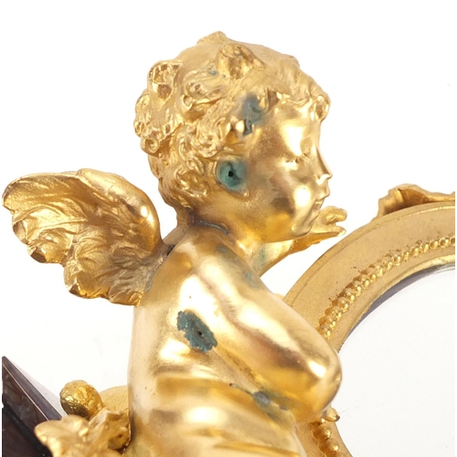 4003 - French Empire style gilt bronze table mirror in the form of putti with a mandolin, raised on a shape... 