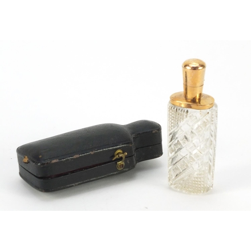 3182 - Dutch cut glass scent bottle with 18ct gold mounts and fitted leather case, impressed marks to the m... 