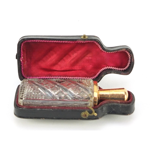 3182 - Dutch cut glass scent bottle with 18ct gold mounts and fitted leather case, impressed marks to the m... 