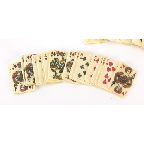 3992 - Set of carved bone playing cards housed in a box, carved with two birds and flowers, each card 3.1cm... 