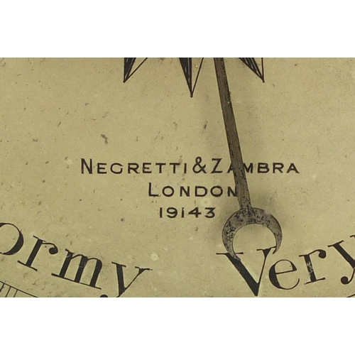 3059 - Negretti & Zambra oak wall barometer with thermometer with silvered dials, numbered 19143, 82cm high