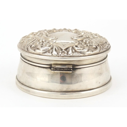 3428 - Circular silver jewel box by WI Broadway & Co, the hinged lid embossed with birds amongst flowers, L... 