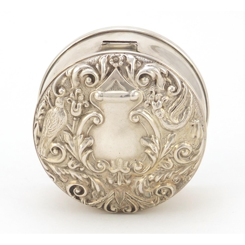 3428 - Circular silver jewel box by WI Broadway & Co, the hinged lid embossed with birds amongst flowers, L... 