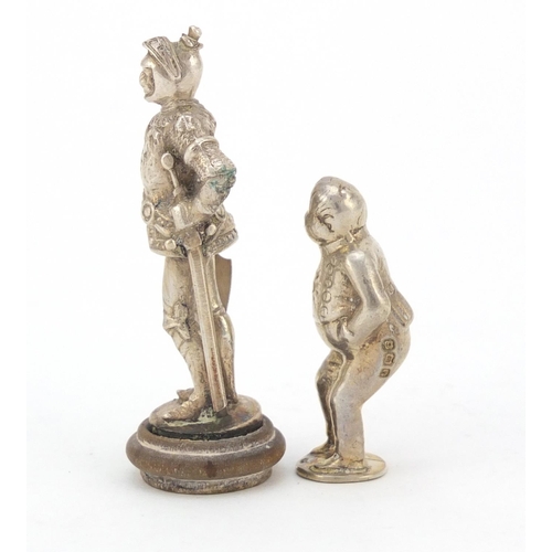 3604 - Two novelty silver figural pipe tampers, including a Knight in a suit of armour, the largest 5.8cm h... 