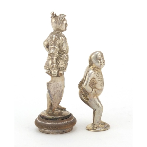 3604 - Two novelty silver figural pipe tampers, including a Knight in a suit of armour, the largest 5.8cm h... 