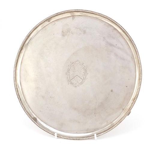 3933 - George III circular silver three footed salver, by Richard Rugg II, London 1781, 25.5cm in diameter,... 