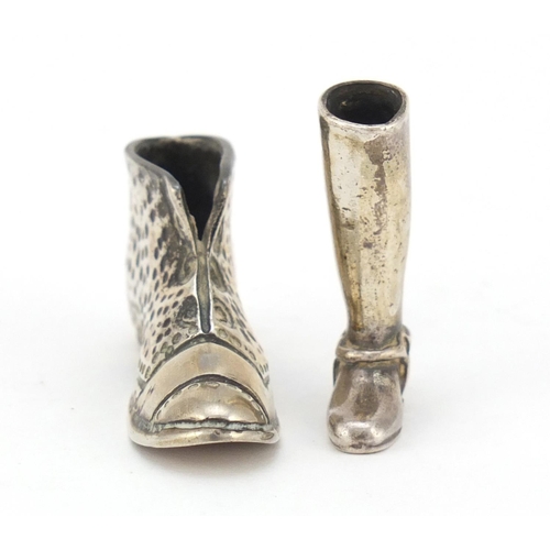 3661 - Novelty unmarked silver match striker in the form of a boot and an Italian silver boot, the largest,... 