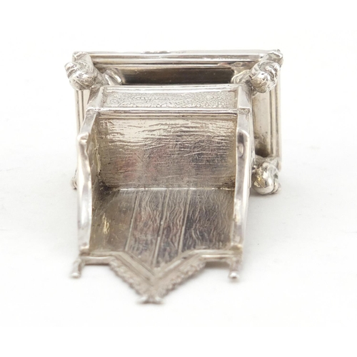 3228 - Miniature silver model of a throne chair with lion supports, indistinct hallmarks, 7.5cm high, 41.0g