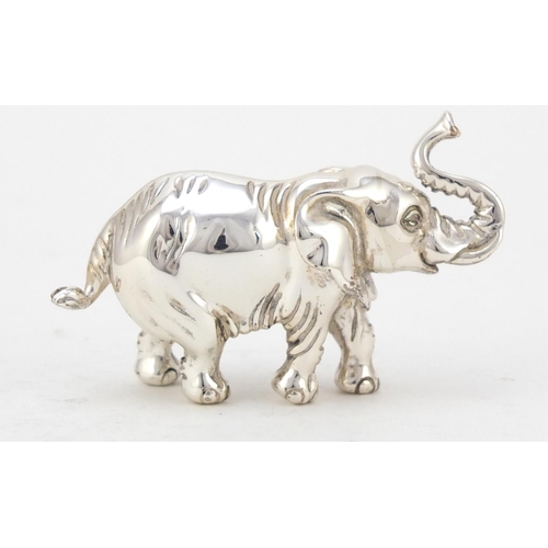 3727 - Miniature silver model of an elephant, hallmarked London 1942, 6cm in length, 52.0g